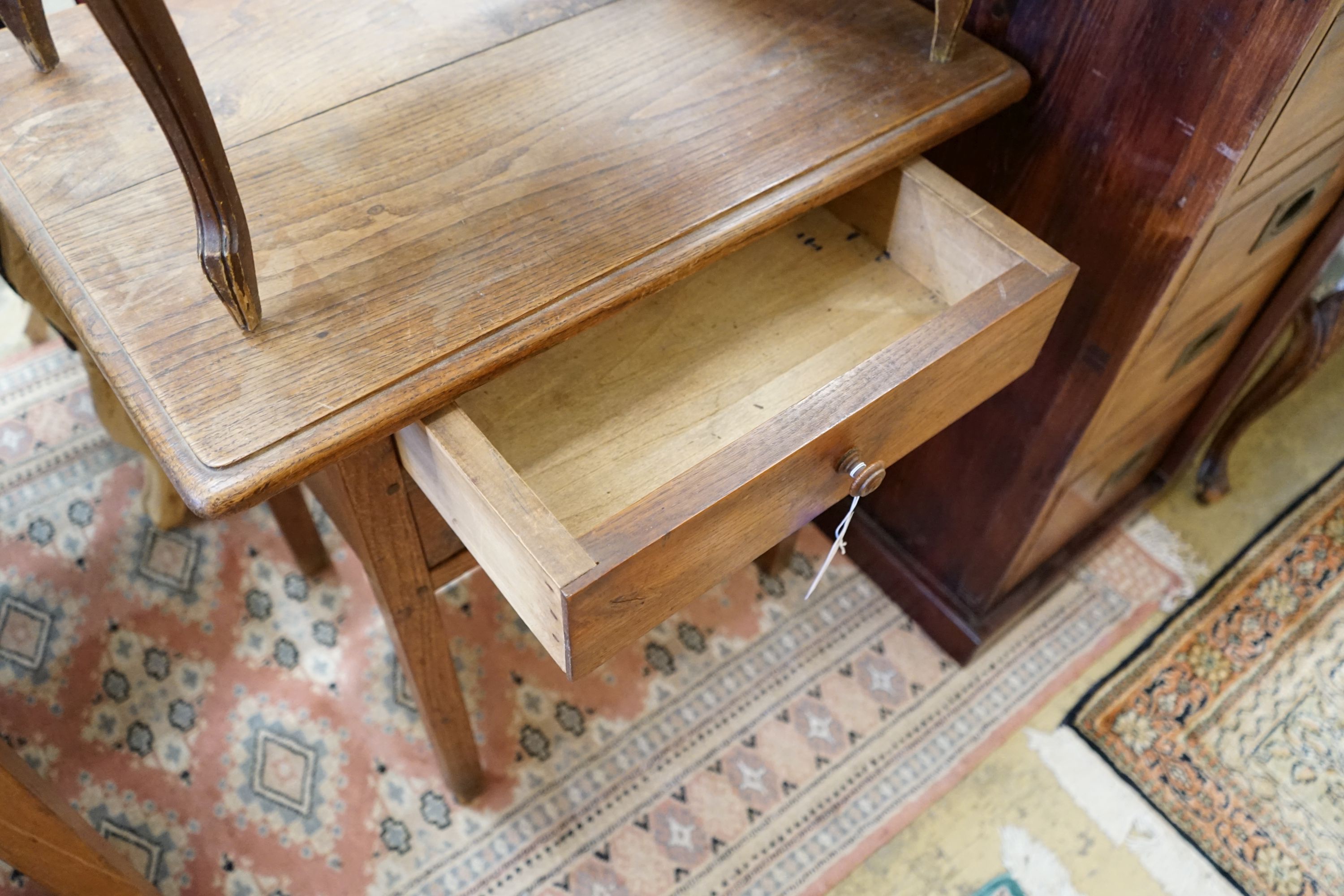 A 19th century provincial oak two drawer side table, width 67cm, depth 50cm, height 72cm